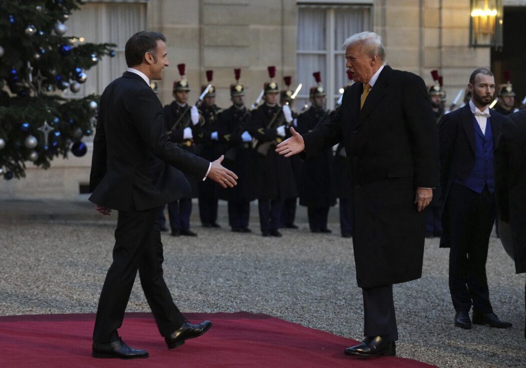 French President Emmanuel Macron, left, is to shake hands with President-elect Donald Trump as he arrives at the Elysee Palace, Saturday, Dec. 7, 2024 in Paris. (AP Photo/Aurelien Morissard)